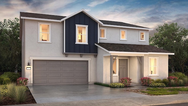 1890 Richard Ave Unit 2054S, Sanger, CA 93657 - view of front of house featuring an attached garage, board and batten siding, driveway, and stucco siding