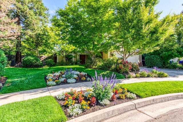 obstructed view of property featuring a garage and driveway