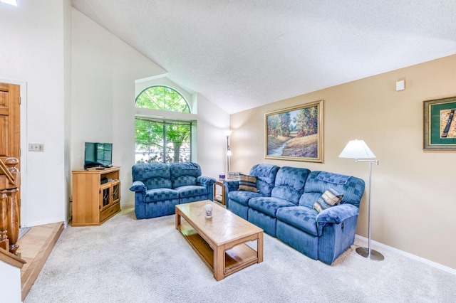 living area featuring carpet, vaulted ceiling, a textured ceiling, and baseboards