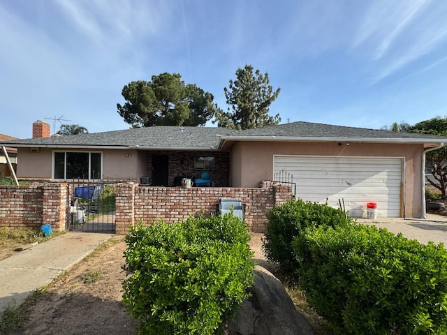 3038 E Sample Ave, Fresno, CA 93710 - ranch-style house featuring stucco siding, a garage, a gate, and concrete driveway