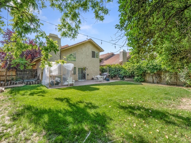 7728 N 8th St, Fresno, CA 93720 - back of house with stucco siding, a chimney, and a patio area