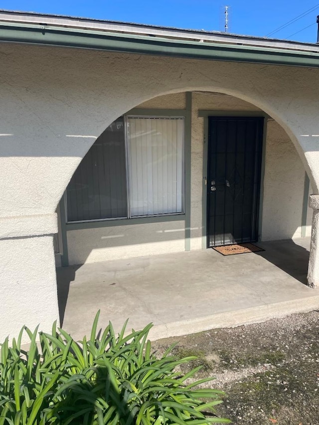 4002 E Dakota Ave, Fresno, CA 93726 - doorway to property with stucco siding