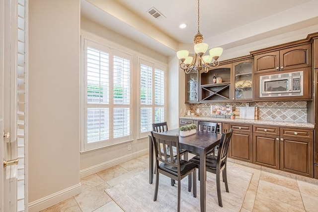 7762 N Hillsdale Dr, Fresno, CA 93720 - dining room featuring a chandelier, baseboards, light tile patterned floors, and recessed lighting