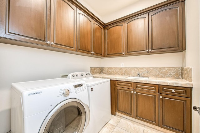 7762 N Hillsdale Dr, Fresno, CA 93720 - laundry room with cabinet space, independent washer and dryer, and light tile patterned floors