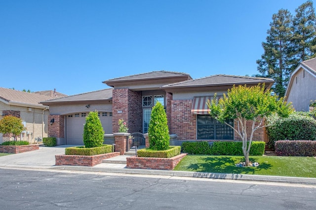7762 N Hillsdale Dr, Fresno, CA 93720 - view of front of house featuring a garage, driveway, brick siding, and a tiled roof