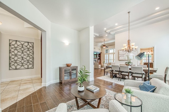 7762 N Hillsdale Dr, Fresno, CA 93720 - living room with a chandelier, recessed lighting, ceiling fan, wood tiled floors, and baseboards