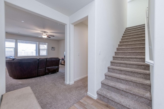 359 Rebel St, Reedley, CA 93654 - staircase with ceiling fan, wood finished floors, and baseboards