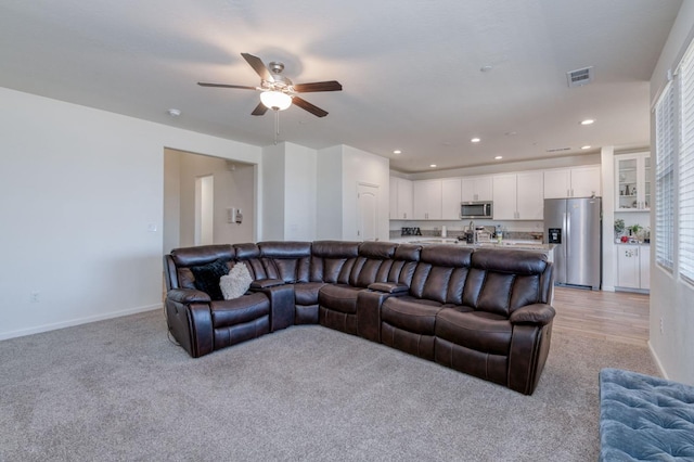 359 Rebel St, Reedley, CA 93654 - living area with light colored carpet, a ceiling fan, baseboards, and recessed lighting