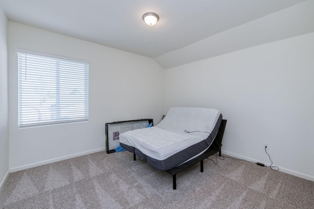 359 Rebel St, Reedley, CA 93654 - living area featuring carpet floors, vaulted ceiling, and baseboards