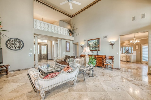 2589 W Lake Van Ness Cir, Fresno, CA 93711 - living room with ornamental molding, ornate columns, high vaulted ceiling, baseboards, and plenty of natural light