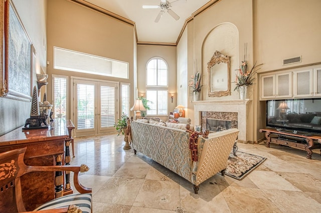 2589 W Lake Van Ness Cir, Fresno, CA 93711 - living area with a high ceiling, ornamental molding, a ceiling fan, and a fireplace