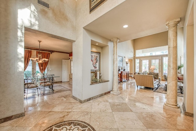2589 W Lake Van Ness Cir, Fresno, CA 93711 - foyer with ornate columns, a high ceiling, baseboards, a chandelier, and recessed lighting