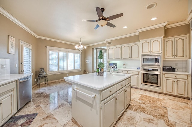 2589 W Lake Van Ness Cir, Fresno, CA 93711 - kitchen with appliances with stainless steel finishes, a sink, crown molding, light countertops, and tasteful backsplash
