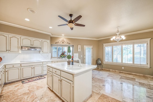 2589 W Lake Van Ness Cir, Fresno, CA 93711 - kitchen with stovetop, a sink, a ceiling fan, light countertops, and under cabinet range hood