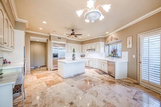 2589 W Lake Van Ness Cir, Fresno, CA 93711 - kitchen with stainless steel dishwasher, crown molding, built in fridge, a center island, and a chandelier