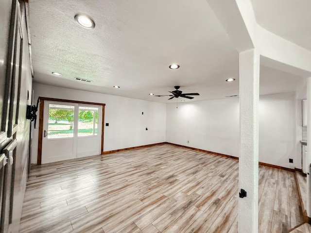 7784 S Del Rey Ave, Del Rey, CA 93616 - unfurnished living room with ceiling fan, light wood-style flooring, recessed lighting, baseboards, and a textured ceiling