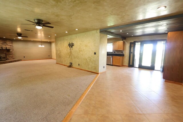 7784 S Del Rey Ave, Del Rey, CA 93616 - unfurnished living room featuring recessed lighting, baseboards, a ceiling fan, light tile patterned flooring, and a stone fireplace