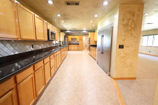 7784 S Del Rey Ave, Del Rey, CA 93616 - kitchen featuring appliances with stainless steel finishes, recessed lighting, dark countertops, tasteful backsplash, and a sink