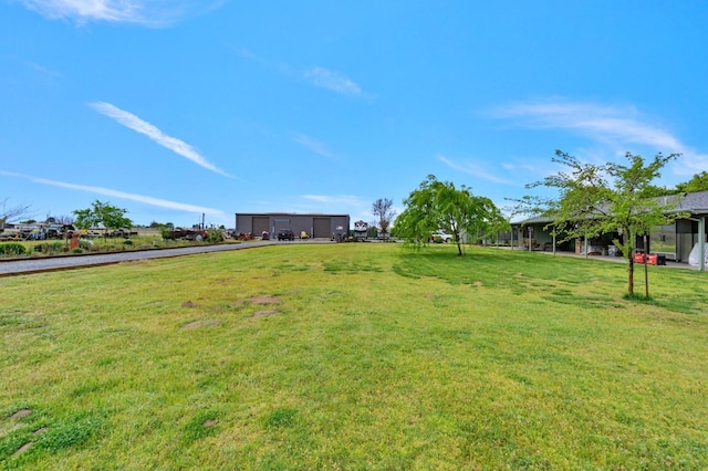 7784 S Del Rey Ave, Del Rey, CA 93616 - view of grassy yard with a garage