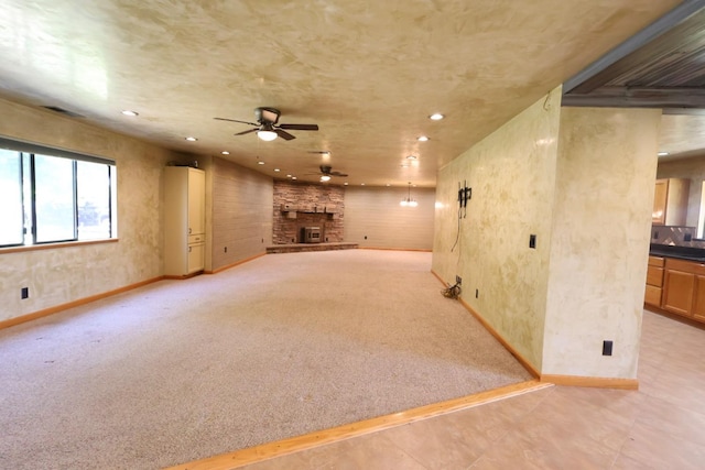 7784 S Del Rey Ave, Del Rey, CA 93616 - unfurnished living room with ceiling fan, baseboards, recessed lighting, a fireplace, and light colored carpet