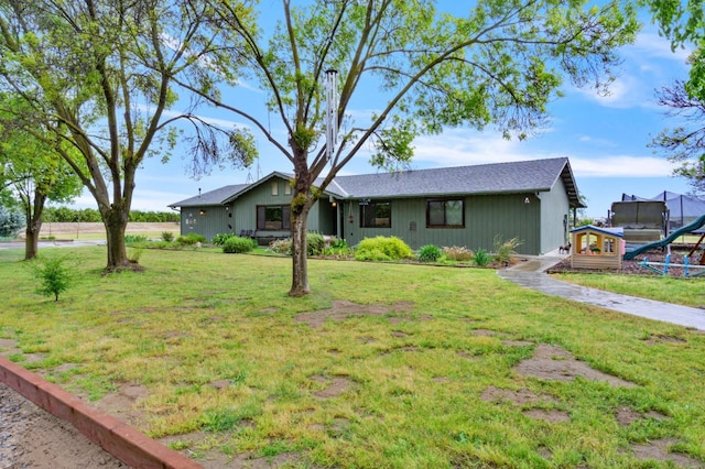 7784 S Del Rey Ave, Del Rey, CA 93616 - ranch-style house featuring a trampoline and a front lawn