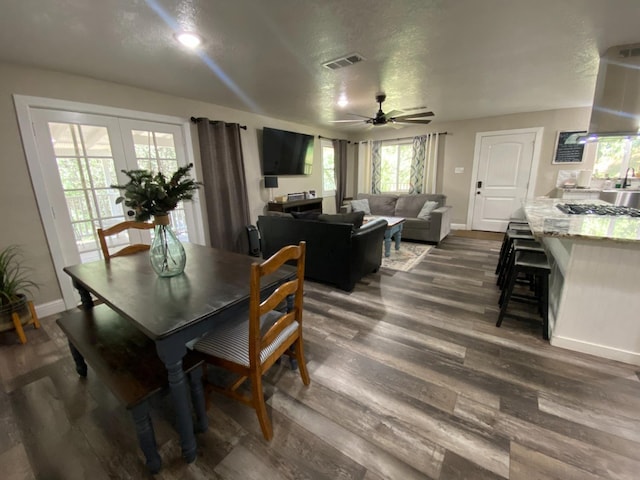 50740 Chu Ranch Rd, Oakhurst, CA 93644 - dining room featuring ceiling fan, dark wood-style flooring, baseboards, and french doors