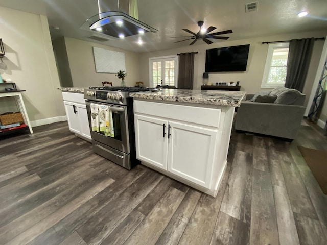 50740 Chu Ranch Rd, Oakhurst, CA 93644 - kitchen featuring stainless steel range with gas cooktop, dark wood-type flooring, white cabinetry, and open floor plan