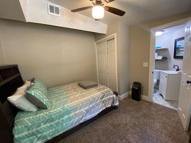 50740 Chu Ranch Rd, Oakhurst, CA 93644 - bedroom featuring a sink, light carpet, a closet, ceiling fan, and baseboards
