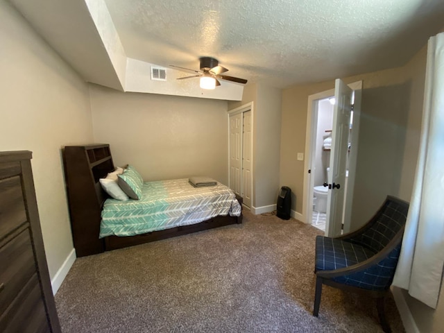 50740 Chu Ranch Rd, Oakhurst, CA 93644 - bedroom featuring a textured ceiling, carpet, a closet, ceiling fan, and baseboards