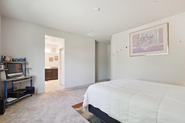 2315 Creekview Dr, Merced, CA 95340 - bedroom with light colored carpet, ensuite bathroom, and baseboards