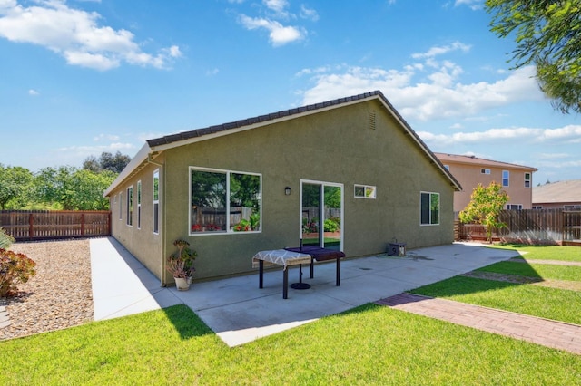 2315 Creekview Dr, Merced, CA 95340 - rear view of property featuring stucco siding and a patio