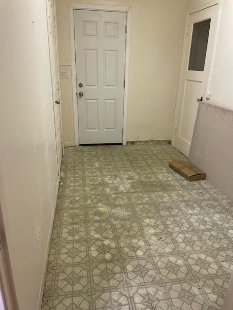 spare room with light flooring