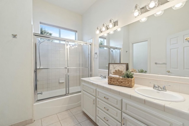 3365 N Emperor Ave, Fresno, CA 93737 - bathroom featuring tile patterned flooring, bath / shower combo with glass door, and double vanity