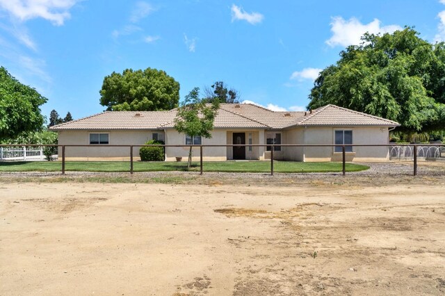 3365 N Emperor Ave, Fresno, CA 93737 - ranch-style house with stucco siding, fence, and a tiled roof