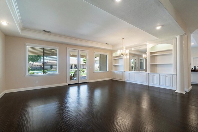 3365 N Emperor Ave, Fresno, CA 93737 - unfurnished living room featuring a tray ceiling, a chandelier, ornamental molding, decorative columns, and baseboards
