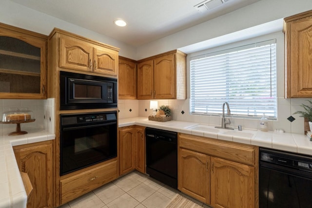 3365 N Emperor Ave, Fresno, CA 93737 - kitchen featuring black appliances, a sink, decorative backsplash, tile counters, and recessed lighting