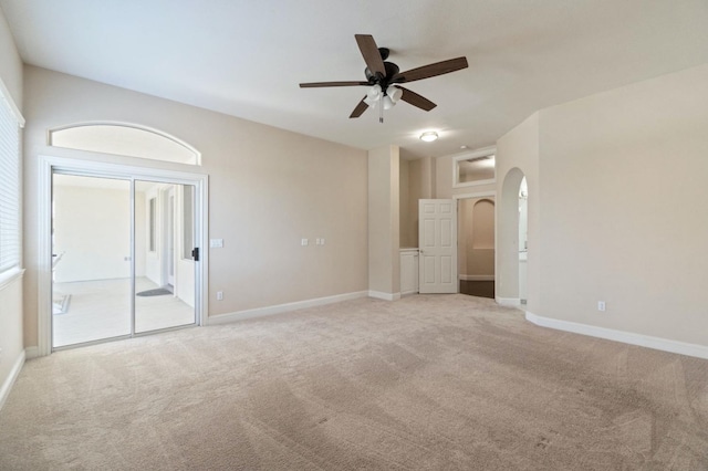 3365 N Emperor Ave, Fresno, CA 93737 - carpeted empty room with a ceiling fan, baseboards, and arched walkways