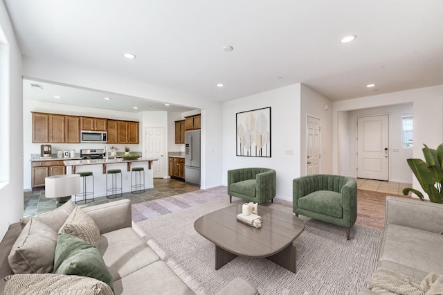 living room featuring recessed lighting and baseboards