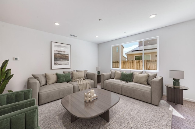 carpeted living room with recessed lighting