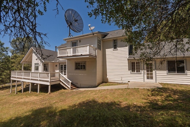 39976 Pierce Lake Dr, Oakhurst, CA 93644 - rear view of house featuring a lawn, a deck, roof with shingles, and a balcony
