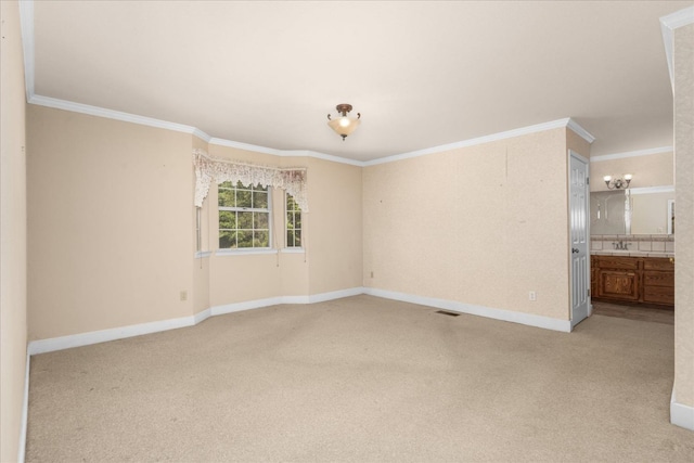 39976 Pierce Lake Dr, Oakhurst, CA 93644 - spare room with light carpet, baseboards, ornamental molding, and a sink