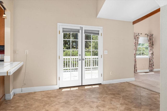 39976 Pierce Lake Dr, Oakhurst, CA 93644 - doorway with light tile patterned floors, baseboards, french doors, and lofted ceiling