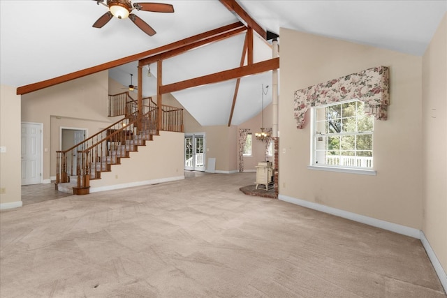 39976 Pierce Lake Dr, Oakhurst, CA 93644 - unfurnished living room with a ceiling fan, stairway, high vaulted ceiling, carpet, and baseboards