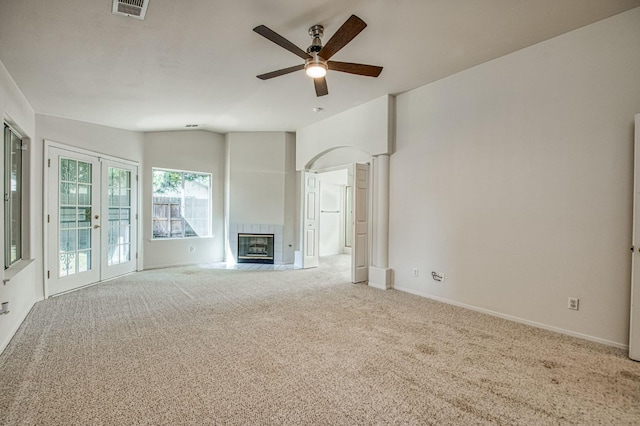 2113 E Portland Ave, Fresno, CA 93720 - unfurnished living room featuring carpet floors, ceiling fan, vaulted ceiling, baseboards, and a tile fireplace