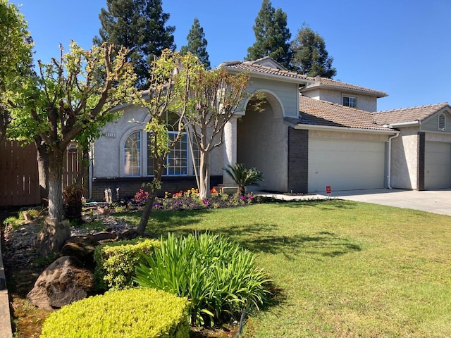 2113 E Portland Ave, Fresno, CA 93720 - mediterranean / spanish-style house with a garage, a tile roof, concrete driveway, and stucco siding