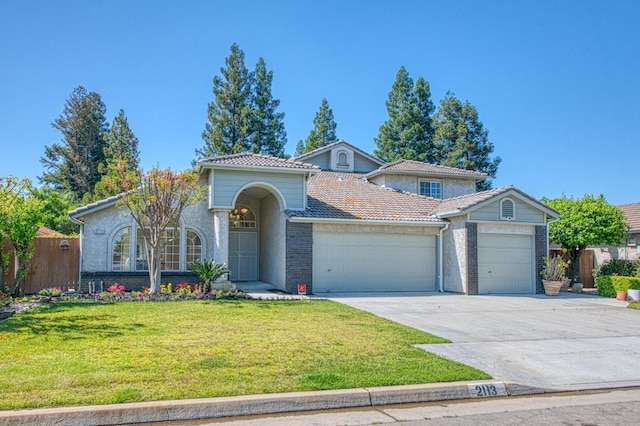 2113 E Portland Ave, Fresno, CA 93720 - mediterranean / spanish home with a garage, concrete driveway, brick siding, and a tile roof