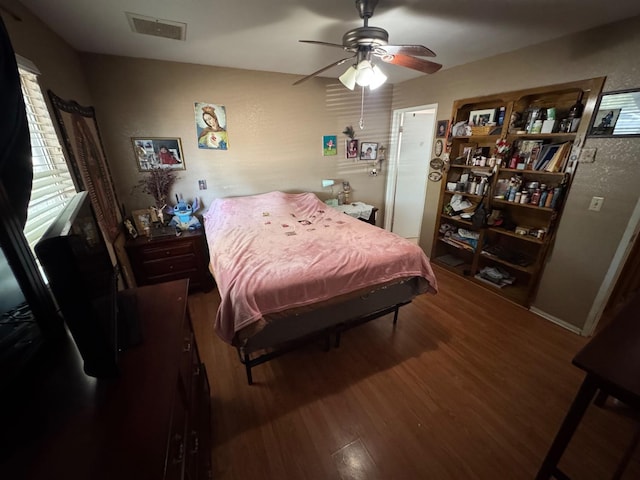 bedroom with wood finished floors and ceiling fan