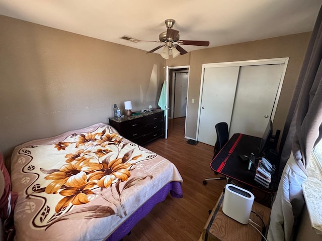 bedroom featuring wood finished floors, a closet, and ceiling fan