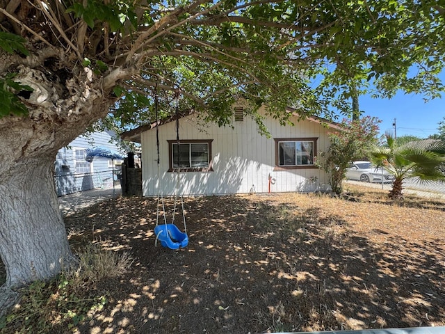 view of front of house with fence