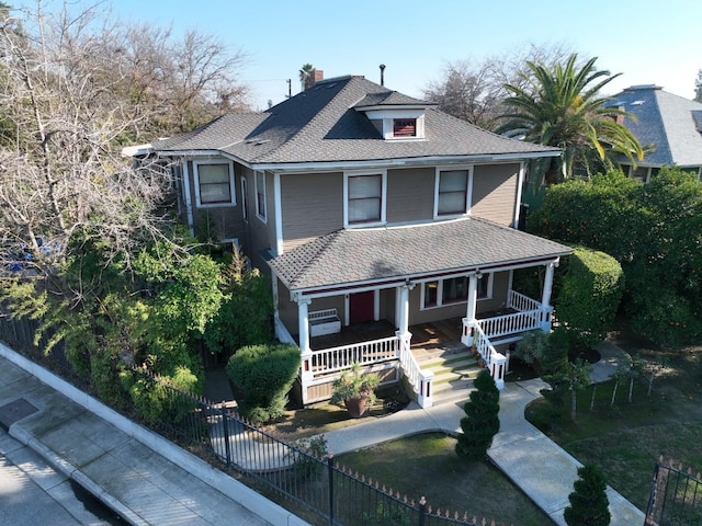 340 N Fulton St, Fresno, CA 93701 - view of front of home with covered porch, a chimney, and a shingled roof